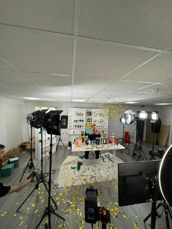 A Cipher studio set after a LIVE, with confetti on the floor