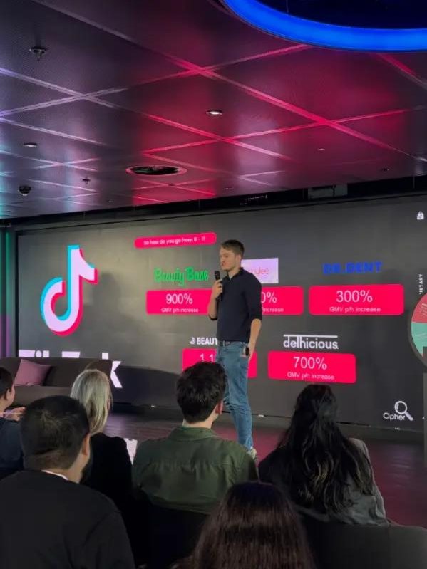 Cipher speaking on stage at a TikTok Shop event
